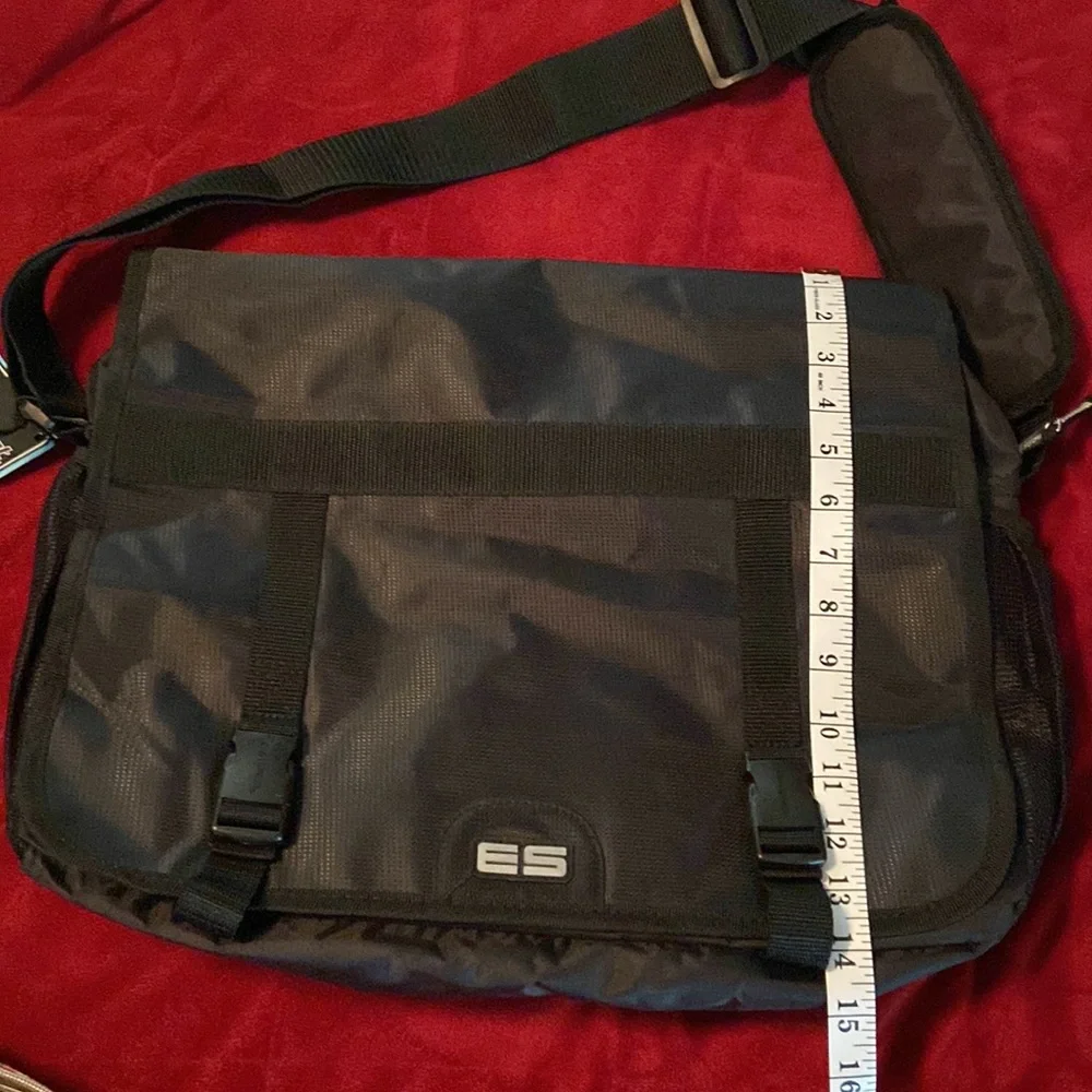 Messenger bag features laptop sleeve- multi- function pockets— Adjustable strap